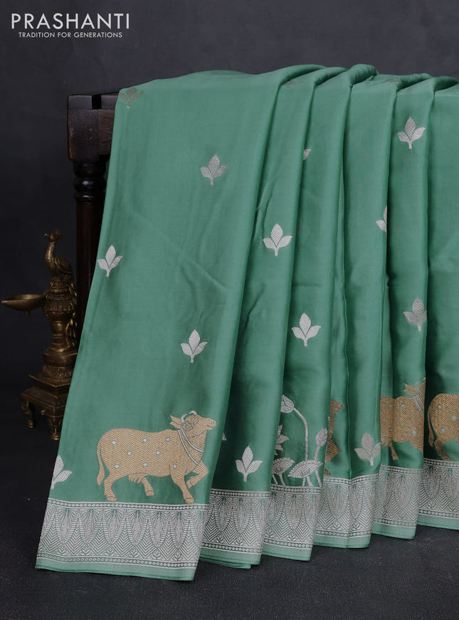 Art mushru silk saree teal green with silver zari woven buttas and pichwai zari woven border