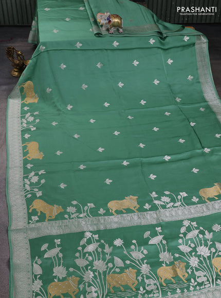 Art mushru silk saree teal green with silver zari woven buttas and pichwai zari woven border