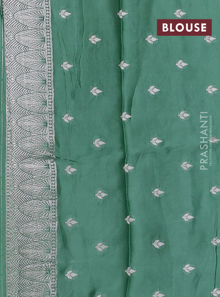 Art mushru silk saree teal green with silver zari woven buttas and pichwai zari woven border