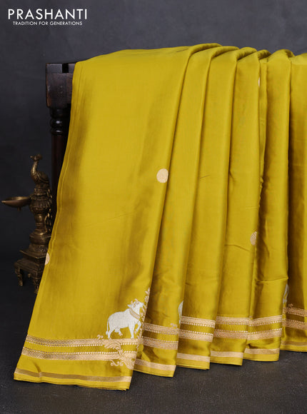 Art mushru silk saree mustard green with zari woven coin buttas and zari woven border