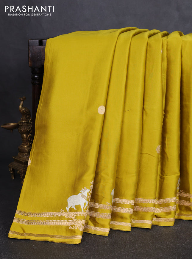 Art mushru silk saree mustard green with zari woven coin buttas and zari woven border