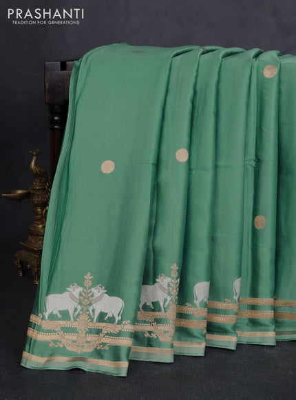 Art mushru silk saree pastel green with zari woven coin buttas and zari woven border