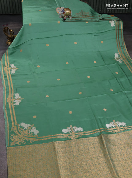 Art mushru silk saree pastel green with zari woven coin buttas and zari woven border