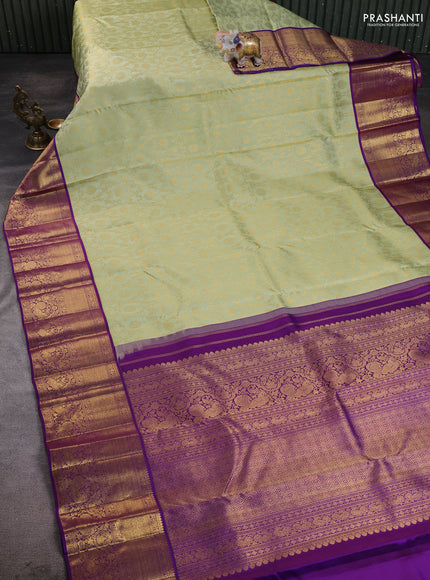 Pure kanchipuram silk saree pista green and violet with allover zari woven brocade weaves and long rich zari woven border