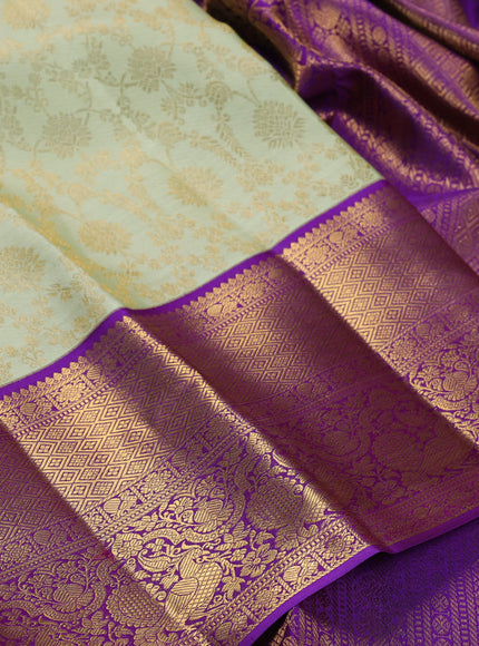 Pure kanchipuram silk saree pista green and violet with allover zari woven brocade weaves and long rich zari woven border