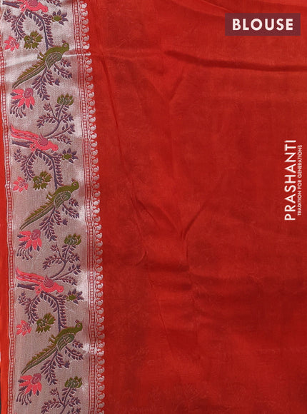 Banarasi raw silk saree orange with silver zari woven geometric buttas and long silver zari woven border
