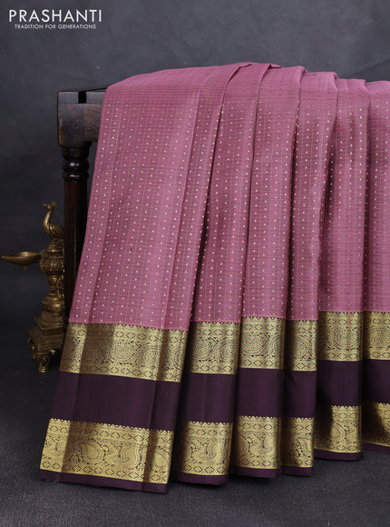 Pure kanchipuram silk saree rosy brown and deep jamun with allover zari woven lakshadeepam pattern and long rettapet zari woven border