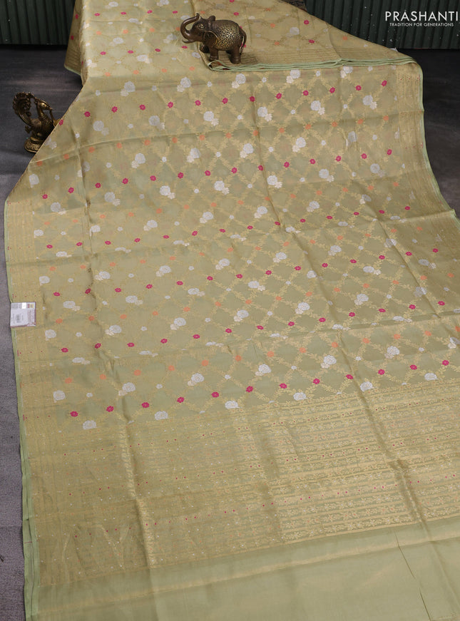 Banarasi tissue uppada silk saree pista green with allover thread & zari floral weaves and zari woven border