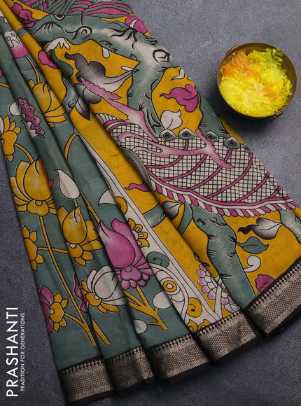 Kalamkari semi silk saree pastel green and black with allover prints and mangalgiri border