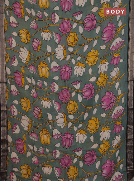 Kalamkari semi silk saree pastel green and black with allover prints and mangalgiri border