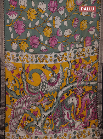 Kalamkari semi silk saree pastel green and black with allover prints and mangalgiri border