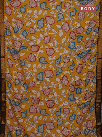 Kalamkari semi silk saree mustard yellow and black with allover prints and mangalgiri border