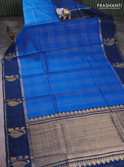 Pure dupion silk saree cs blue with allover zari checked pattern and rettapet zari woven butta border