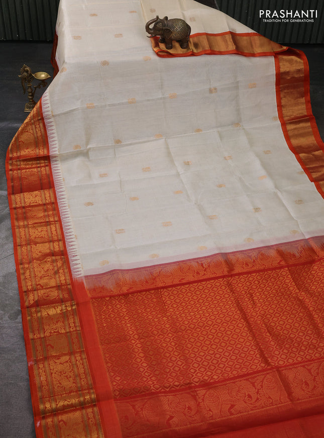Kuppadam silk cotton saree off white and orange with allover vairaosi pattern & buttas and temple design zari woven border