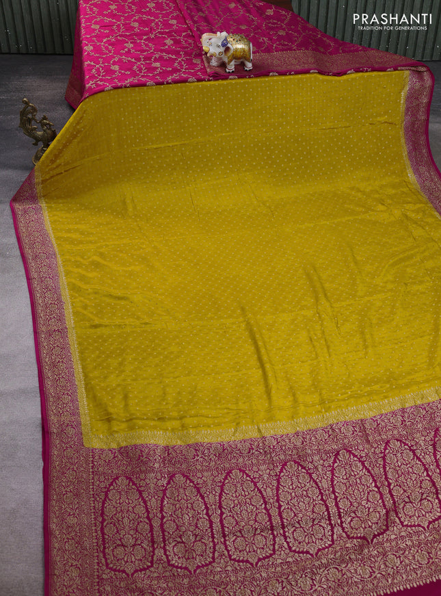 Banarasi crepe partly saree mustard yellow and pink with allover thread & zari woven buttas and woven border