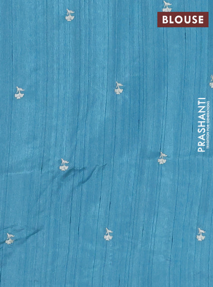 Semi raw silk saree teal blue with embroidery buttas and floral embroidery border