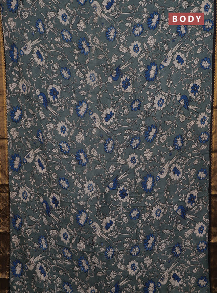 Kalamkari semi silk saree pastel green and black with allover prints and mangalgiri border