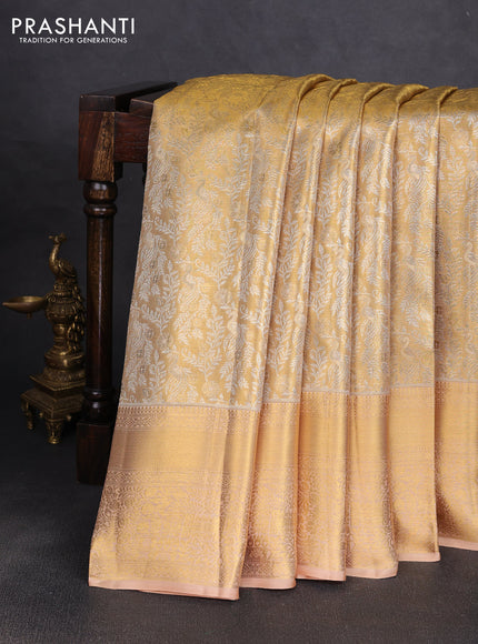 Pure kanchipuram tissue silk saree gold and sandal with alllover zari woven peacock brocade weaves and rich zari woven border