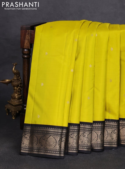 Pure kanchipuram silk saree dark green and mustard yellow with allover zari woven buttas and zari woven korvai border