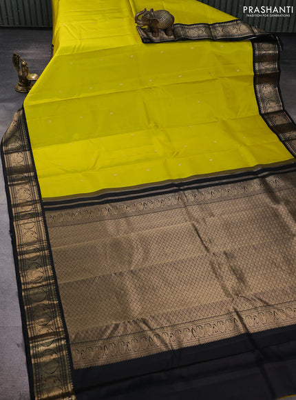 Pure kanchipuram silk saree dark green and mustard yellow with allover zari woven buttas and zari woven korvai border