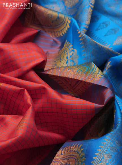 Pure gadwal silk saree orange and teal blue with allover checks & zari buttas and temple design zari woven border