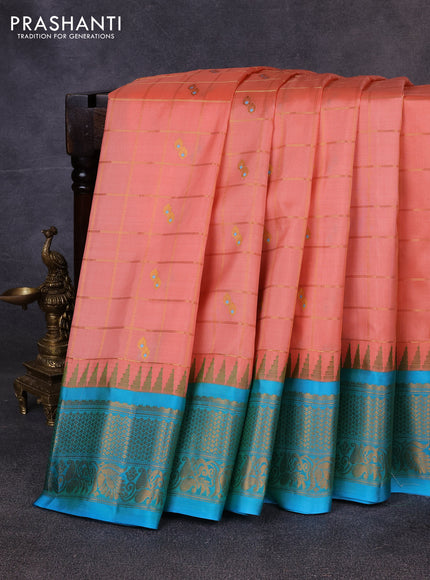 Pure gadwal silk saree peach orange and teal blue with allover zari checks & buttas and temple design zari woven border