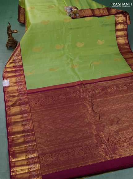 Pure gadwal silk saree pista green and dark magenta with allover zari woven buttas and rich zari woven border