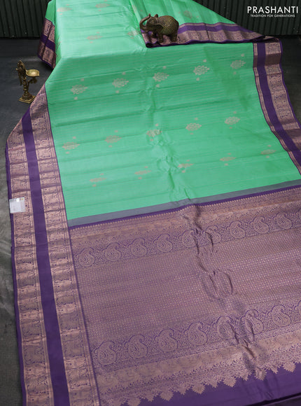 Pure gadwal silk saree teal green and pastel purple with allover zari stripes pattern & buttas and rettapet zari woven border