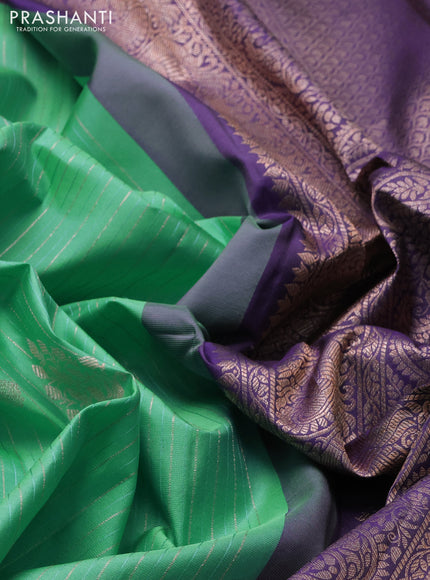 Pure gadwal silk saree teal green and pastel purple with allover zari stripes pattern & buttas and rettapet zari woven border