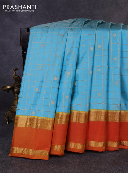 Pure gadwal silk saree teal blue and sunset orange with allover zari checks & buttas and rettapet zari woven border