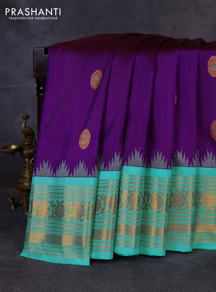 Pure gadwal silk saree purple and teal blue with allover zari woven buttas and temple design zari woven border