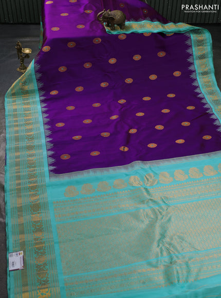 Pure gadwal silk saree purple and teal blue with allover zari woven buttas and temple design zari woven border