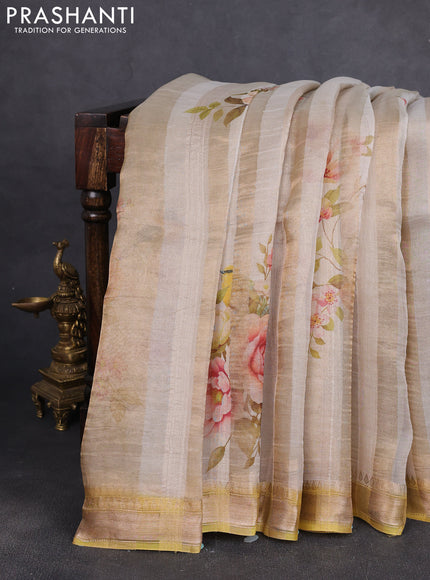 Organza tissue tussar silk saree cream shade with allover zari stripe pattern & floral prints and zari woven border