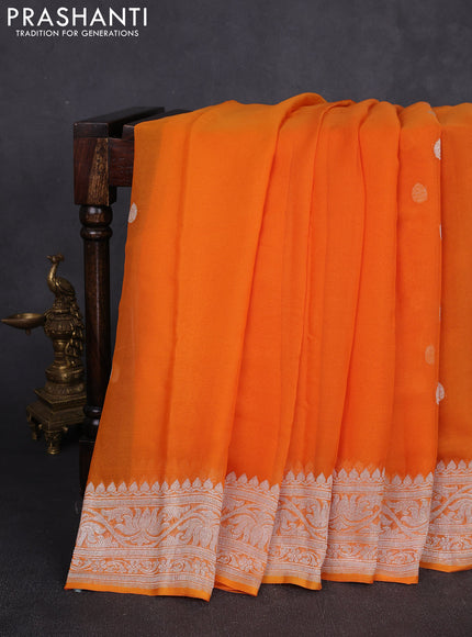 Banarasi chiffon saree orange with allover silver zari woven buttas and silver zari woven floral border