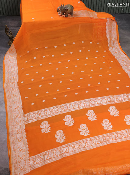 Banarasi chiffon saree orange with allover silver zari woven buttas and silver zari woven floral border