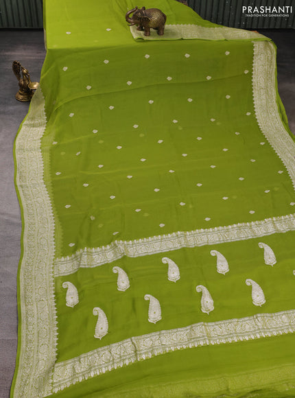 Banarasi chiffon saree lime green with allover silver zari woven buttas and silver zari woven floral border