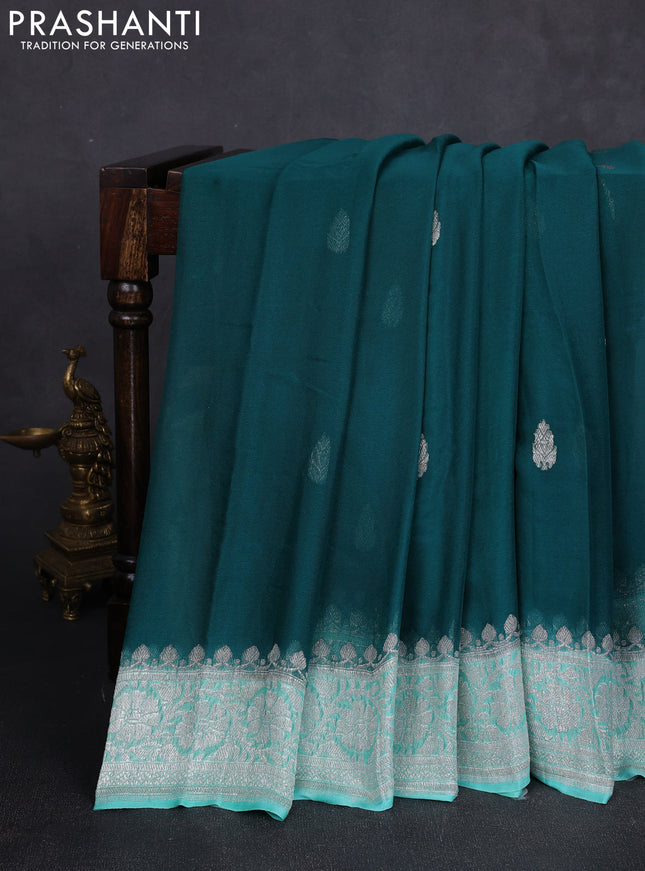 Banarasi chiffon saree peacock green and teal blue with allover silver zari woven buttas and silver zari woven floral border