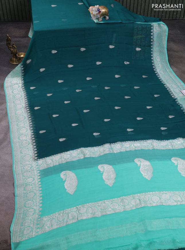 Banarasi chiffon saree peacock green and teal blue with allover silver zari woven buttas and silver zari woven floral border