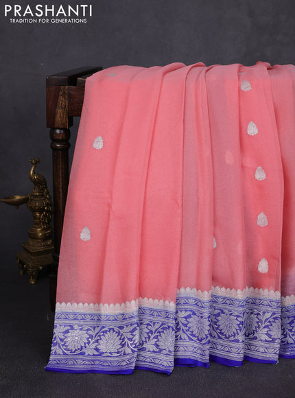 Banarasi chiffon saree peach and royal blue with allover silver zari woven buttas and silver zari woven floral border