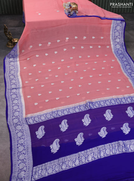 Banarasi chiffon saree peach and royal blue with allover silver zari woven buttas and silver zari woven floral border