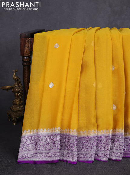 Banarasi chiffon saree yellow and purple with allover silver zari woven buttas and silver zari woven floral border