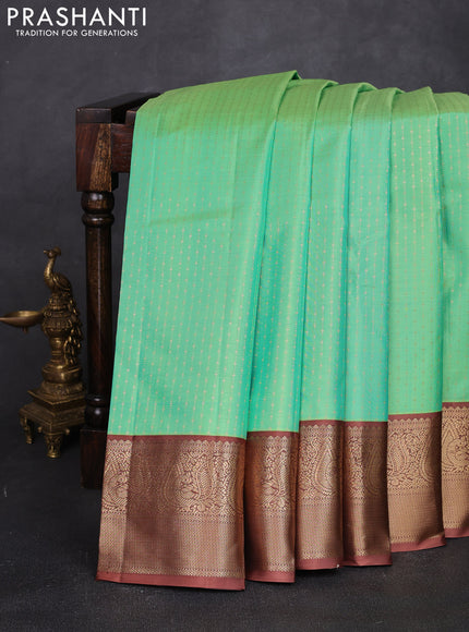 Pure kanchipuram silk saree teal green and dark sandal with allover weaves & zari woven 1000 buttas and zari woven border