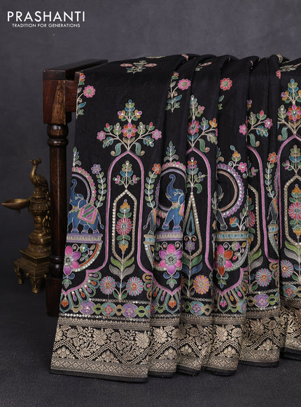 Crepe silk saree black with allover prints & pita embroidery work and zari woven border
