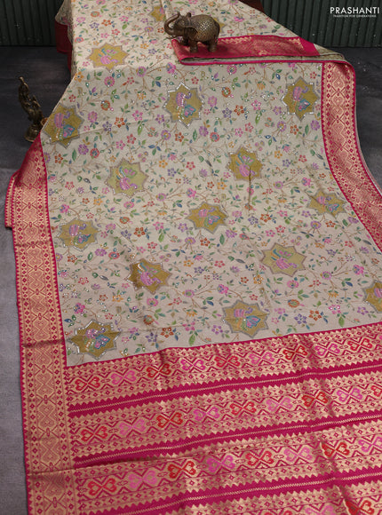 Crepe silk saree beige and pink with allover prints & pita embroidery work and zari woven border