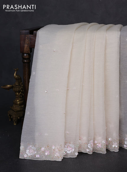 Crush tissue saree cream with sequin embroidery buttas and floral sequin embroidery pallu & border