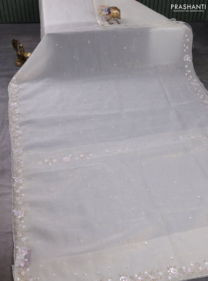 Crush tissue saree cream with sequin embroidery buttas and floral sequin embroidery pallu & border