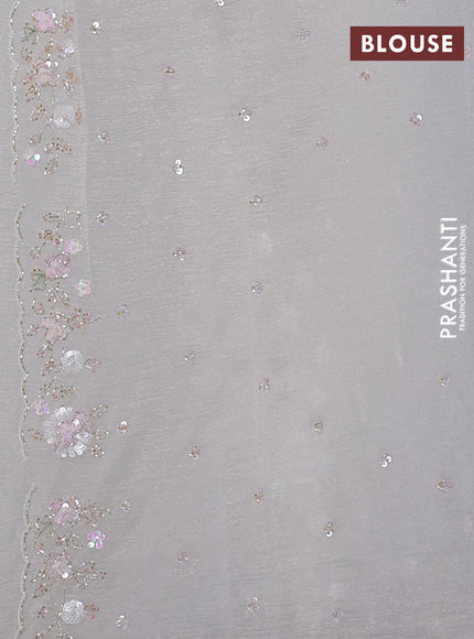 Crush tissue saree cream with sequin embroidery buttas and floral sequin embroidery pallu & border
