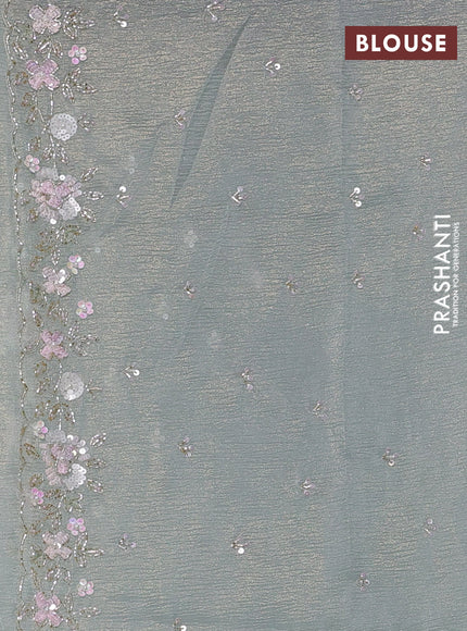 Crush tissue saree pastel green with sequin embroidery buttas and floral sequin embroidery pallu & border