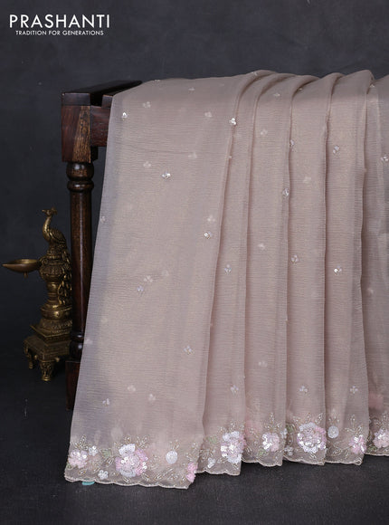 Crush tissue saree beige with sequin embroidery buttas and floral sequin embroidery pallu & border