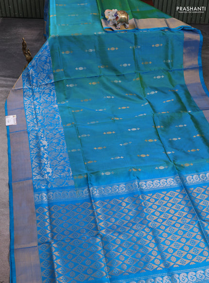 Pure uppada silk saree dual shade of teal green and teal blue with allover silver & zari woven buttas and long zari woven border
